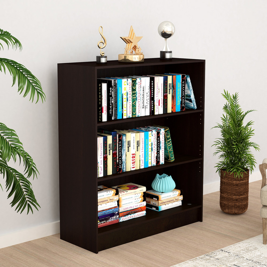 Dark brown bookshelf filled with colorful books and decorative items, flanked by plants.