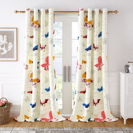 Elegant white curtains with colorful butterfly prints hanging on a window in a bright room.