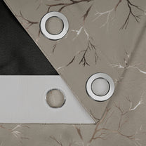 Blackout curtain fabric in ivory with copper branch foil print, metal grommets, and textured backing shown in close-up