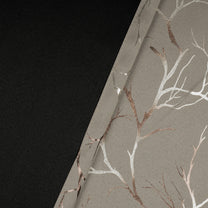 Two-piece blackout curtains with ivory fabric and copper foil branch pattern, shown folded with black backing visible