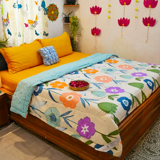 A cozy bedroom featuring a wooden bed with colorful floral bedding, yellow pillows, and wall decorations