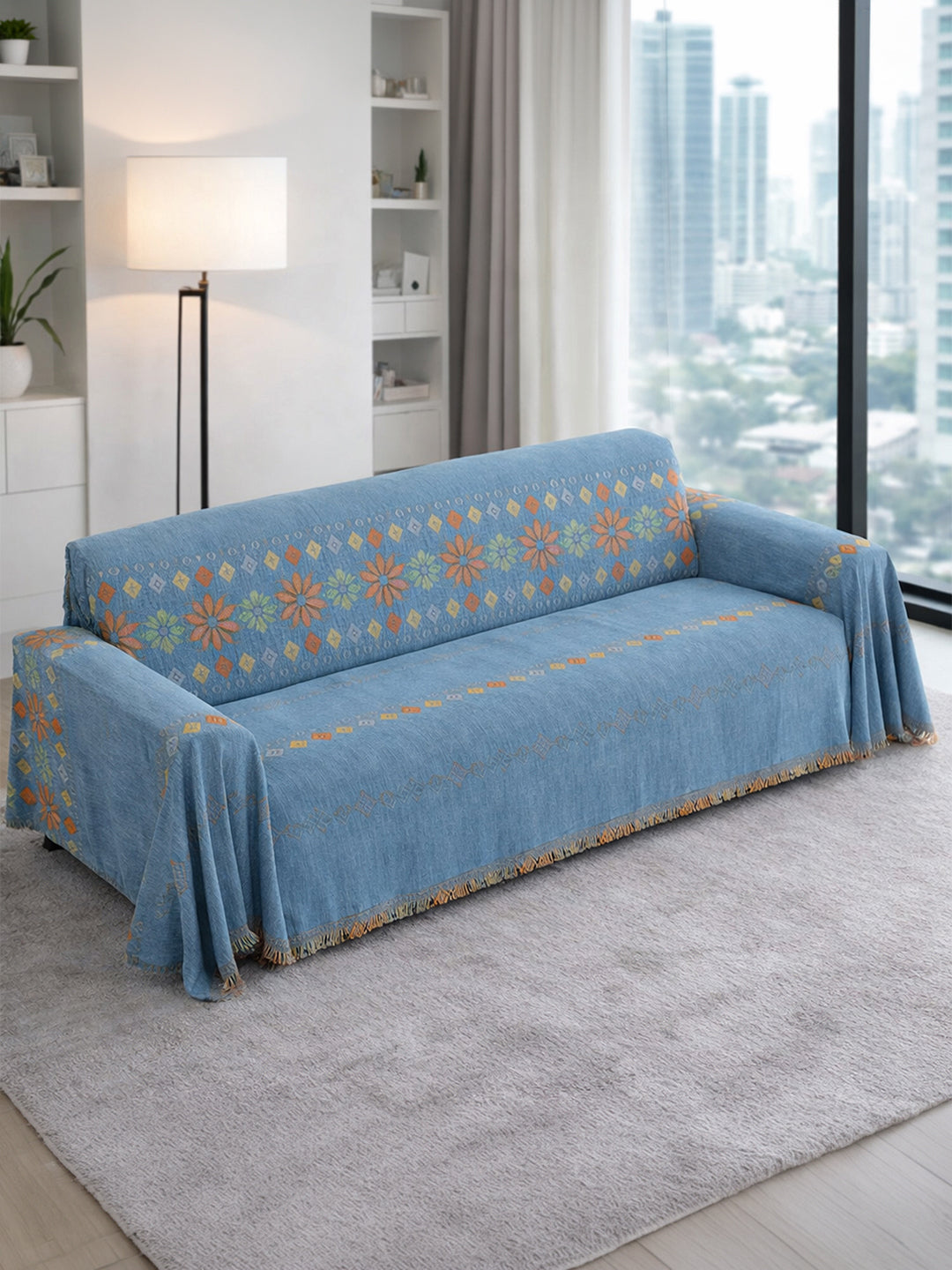 Blue Floral Border chenille sofa throw cover on a 3 seater sofa