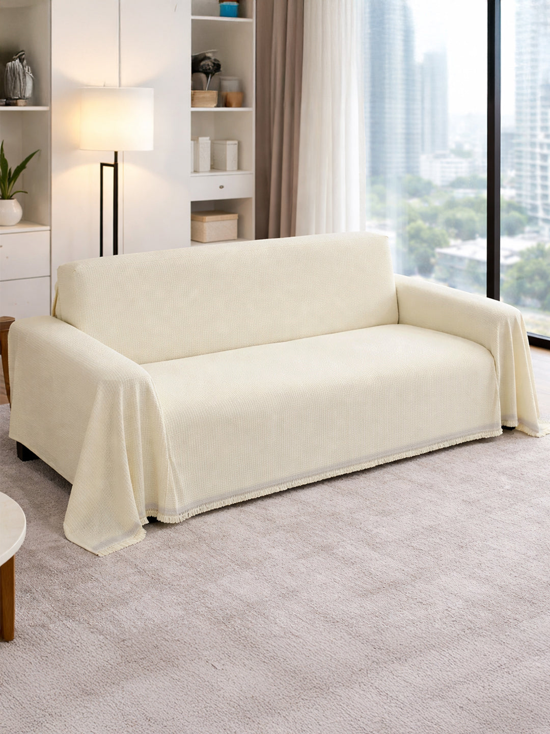 Cream Solid chenille sofa throw cover on a 3 seater sofa