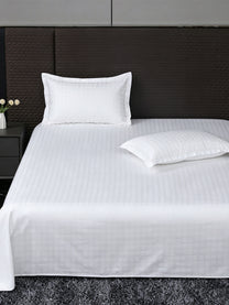 Heritage 500 TC Cotton Jacquard King Bedsheet – White Check on a king bed