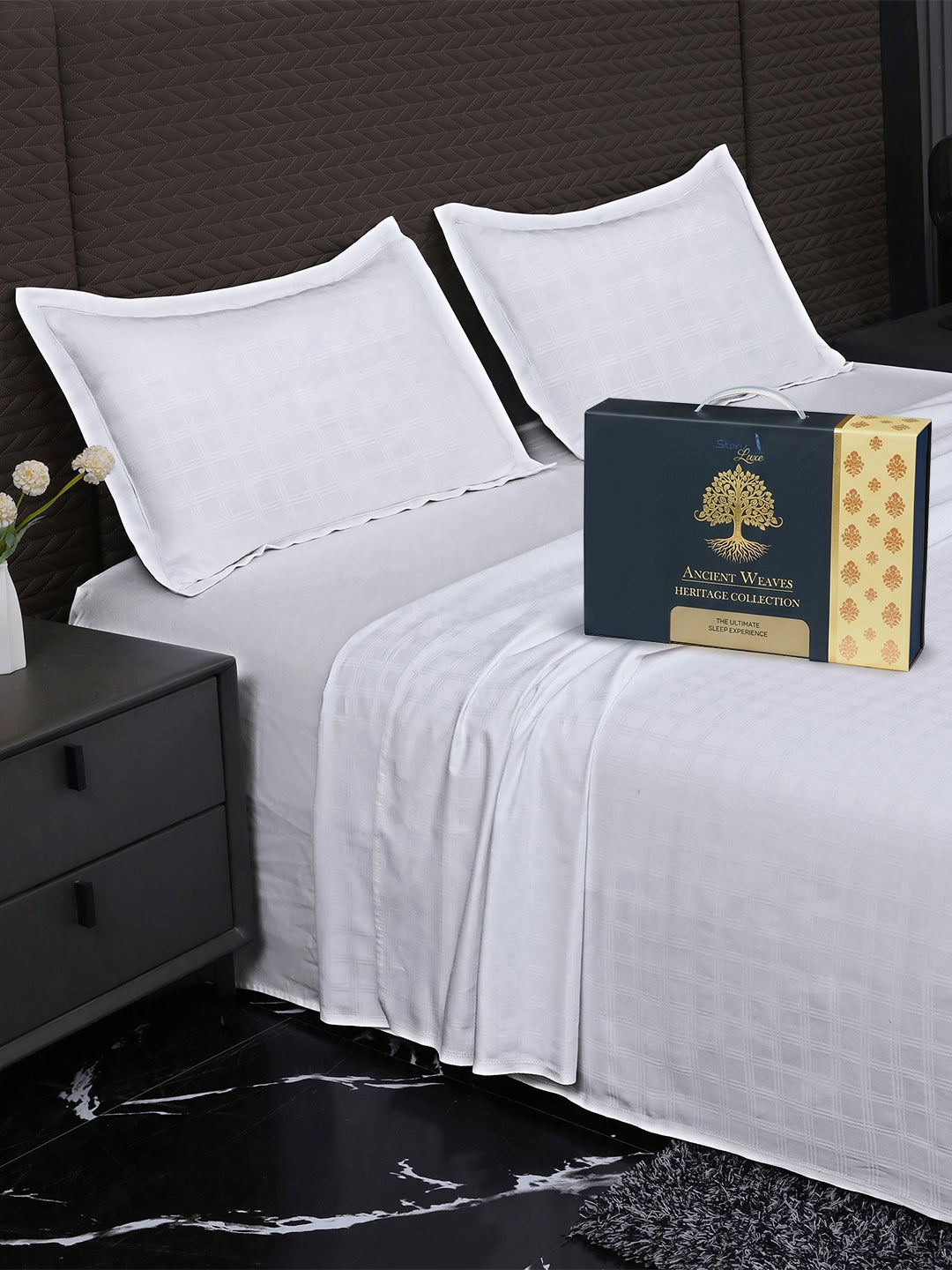 Bedsheet on bed with Ancient Weaves gift box