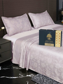 Bedsheet on bed with Ancient Weaves gift box