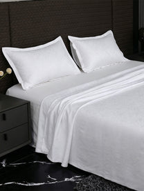 Heritage White bedsheet, side view with pillow covers