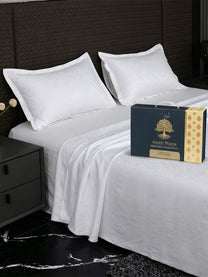 Bedsheet on bed with Ancient Weaves gift box