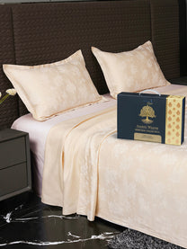 Bedsheet on bed with Ancient Weaves gift box