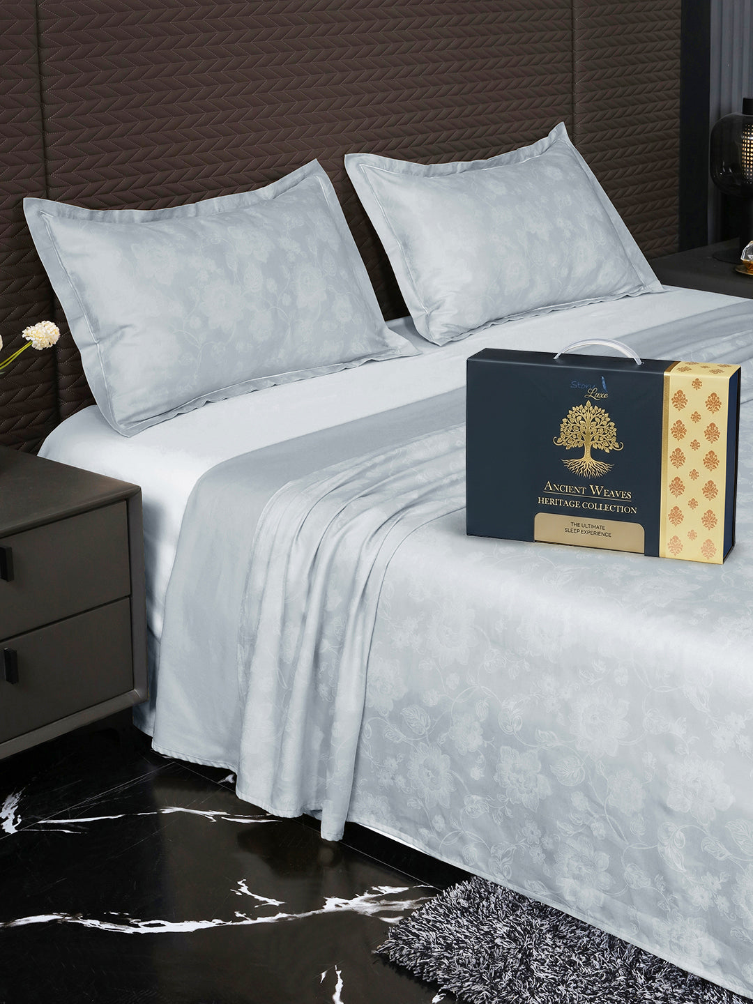 Bedsheet on bed with Ancient Weaves gift box