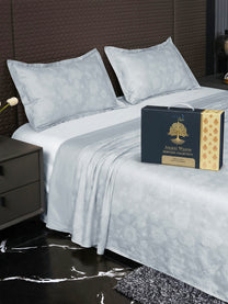 Bedsheet on bed with Ancient Weaves gift box