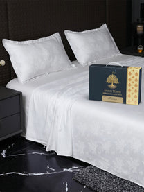 Bedsheet on bed with Ancient Weaves gift box