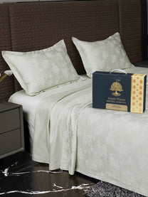 Bedsheet on bed with Ancient Weaves gift box