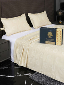 Bedsheet on bed with Ancient Weaves gift box