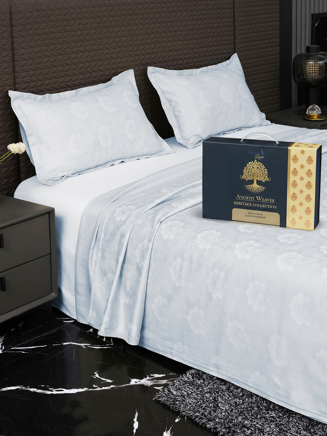 Bedsheet on bed with Ancient Weaves gift box