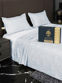 Bedsheet on bed with Ancient Weaves gift box