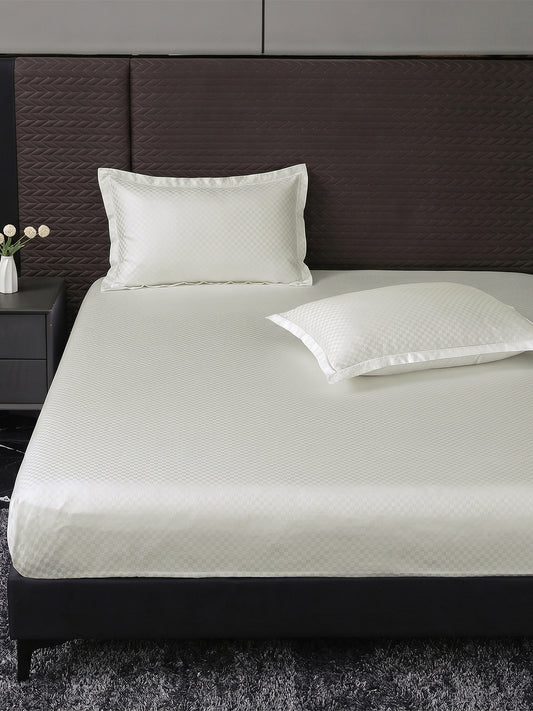 Heritage 500 TC Cotton King Fitted Bedsheet – Ivory on a king bed
