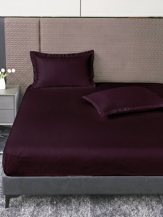 Heritage 500 TC Cotton King Fitted Bedsheet – Plum on a king bed
