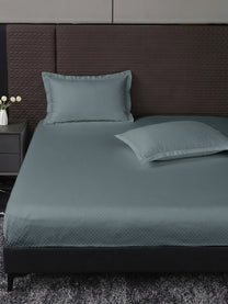 Heritage 500 TC Cotton King Fitted Bedsheet – Slate Blue on a king bed