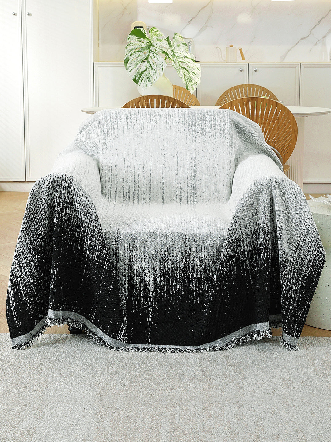 Black Ombre throw on a single seater sofa