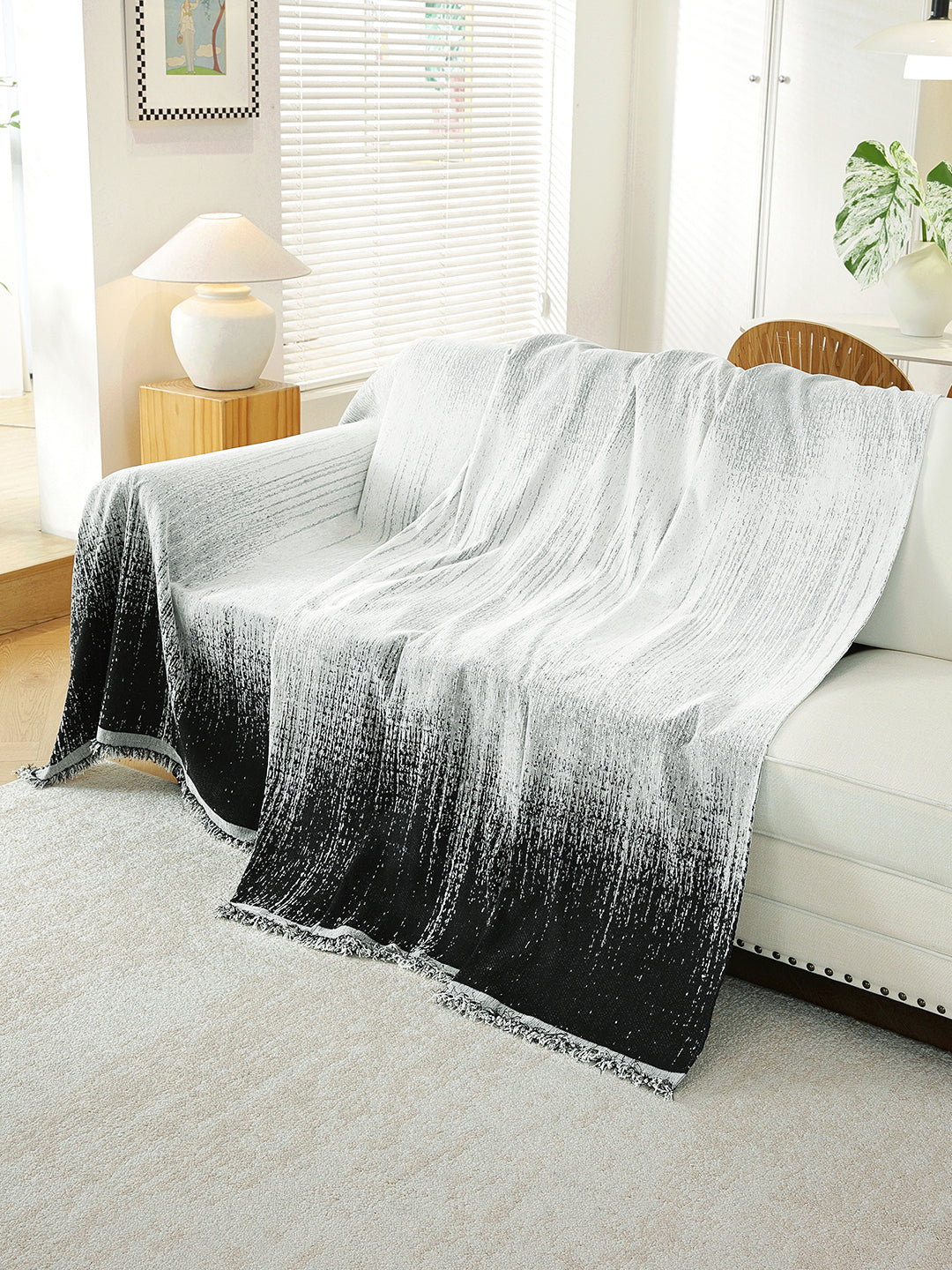 Black Ombre throw draped on a sofa