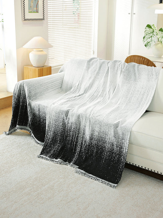 Black Ombre throw draped on a sofa