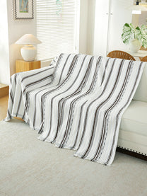 Black & White Stripe throw draped on a sofa