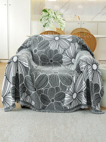 Charcoal Grey Floral throw on a single seater sofa