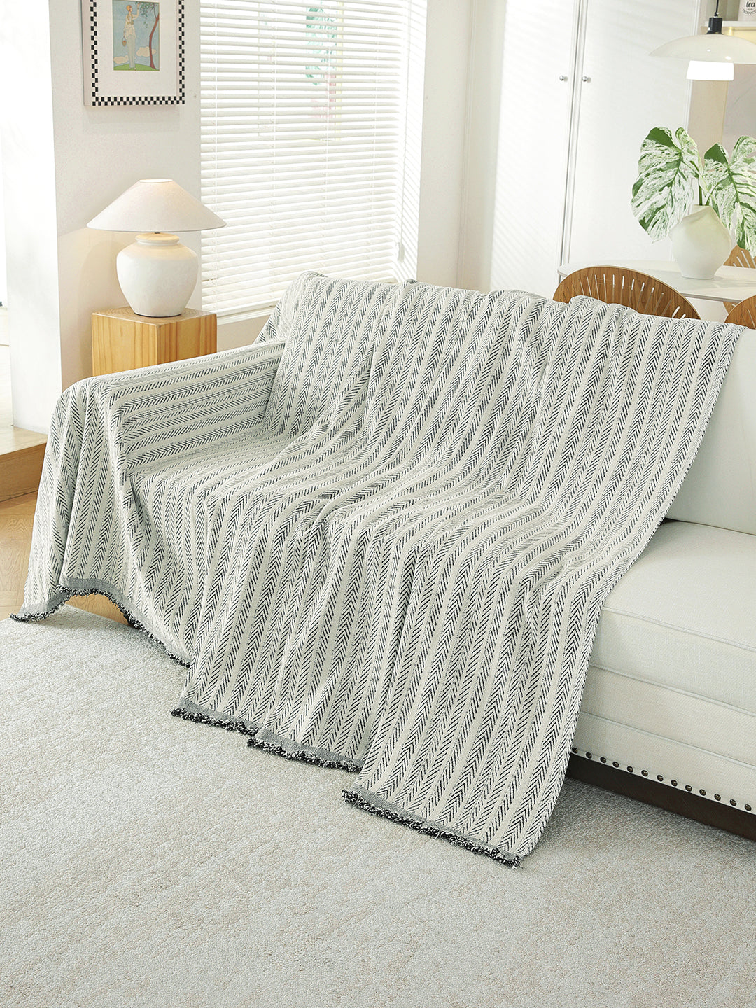 Light Grey Textured throw draped on a sofa
