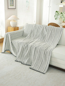 Light Grey Textured throw draped on a sofa