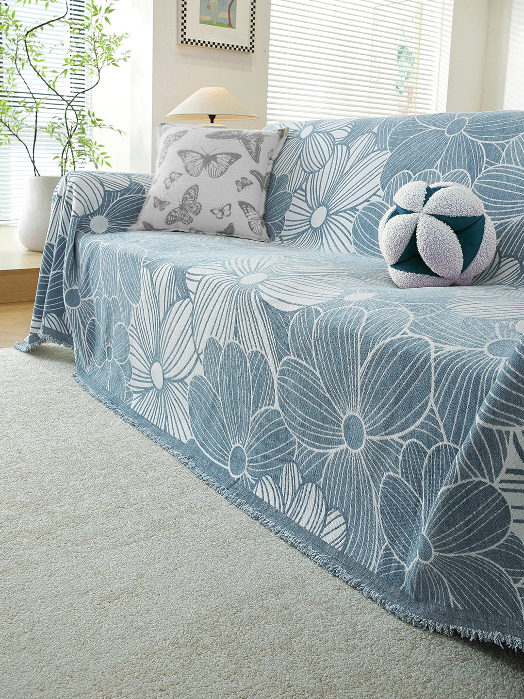 Powder Blue Floral premium chenille sofa throw on a 3 seater sofa