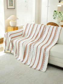 Rust & White Stripe throw draped on a sofa