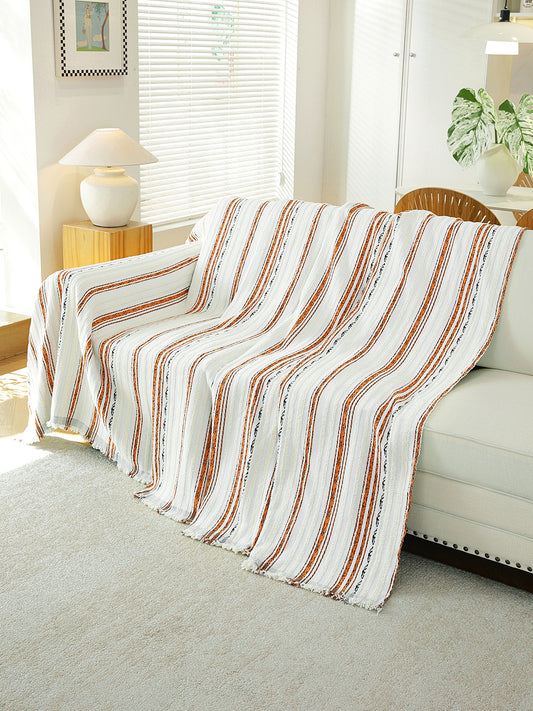Rust & White Stripe throw draped on a sofa