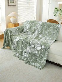 Sage Green Floral throw draped on a sofa