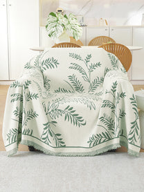 Sage Green Leaf throw on a single seater sofa