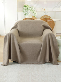 Taupe Solid throw on a single seater sofa