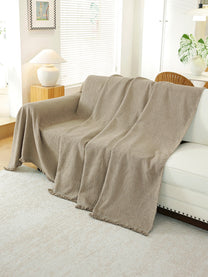 Taupe Solid throw draped on a sofa